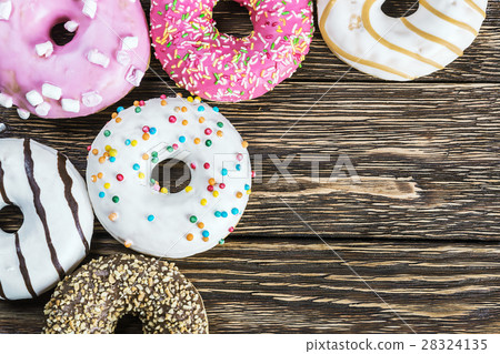 fresh baked glazed donuts on a wooden fresh baked glazed donuts on a wooden 28324135