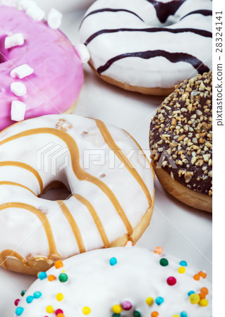 fresh baked glazed donuts in a box  28324141