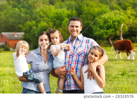 Young family with three children on the farm Young family with three children on the farm 28328576