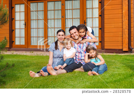 Happy young family with three children Happy young family with three children 28328578