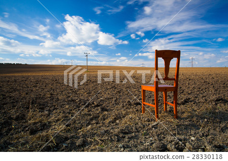 Old wooden chair on the empty field Old wooden chair on the empty field 28330118