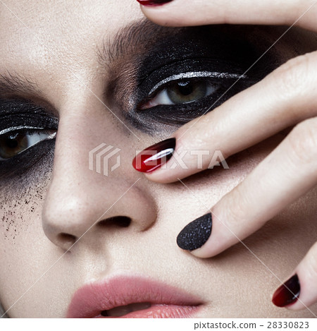 Beautiful blond girl with dark smokey makeup and 28330823