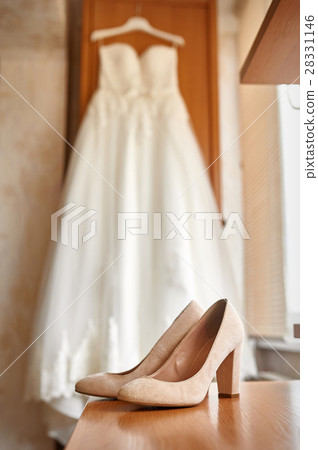 wedding shoes and bride in a bedroom wedding shoes and bride in a bedroom 28331146