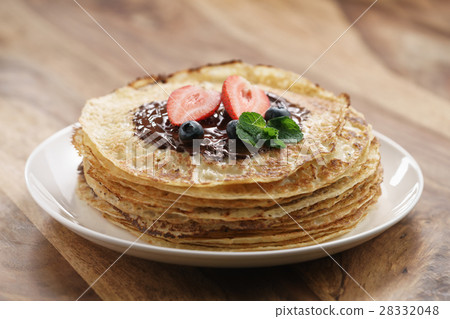 照片素材(圖片): fresh blinis or crepes with melted dark