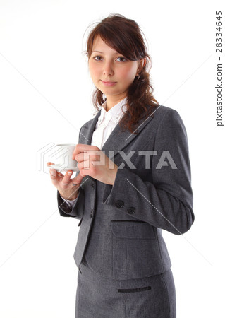 Cheerful business woman holding coffee cup Cheerful business woman holding coffee cup 28334645