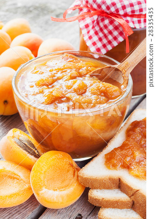 apricot fruits and jar of jam on table apricot fruits and jar of jam on table 28335435