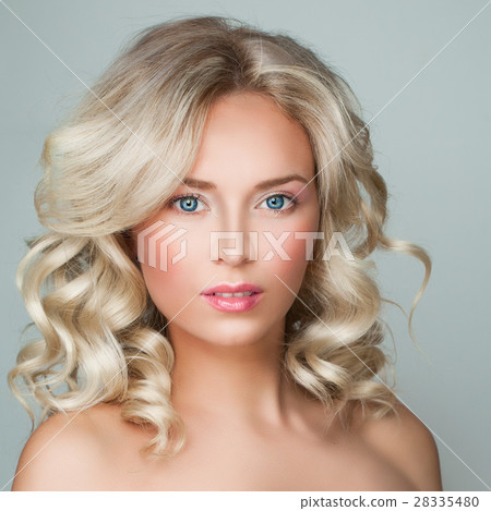 Woman with Healthy Skin and Blond Curly Hairstyle 28335480