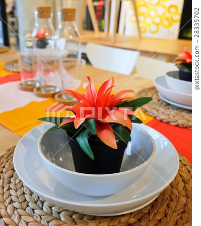 Artificial Plant with Orange Flower on Table 28335702