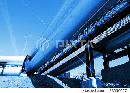 Steel pipelines and valves against blue sky 28336057