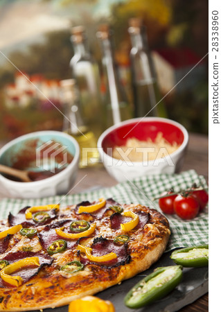 Delicious pizza served on wooden table 28338960