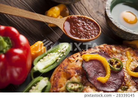Delicious pizza served on wooden table Delicious pizza served on wooden table 28339145