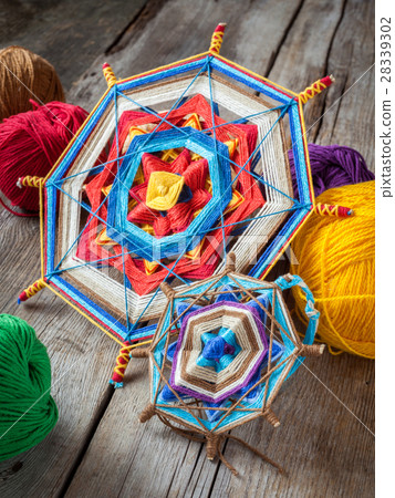 two knitted tibetan mandala from threads and yarn two knitted tibetan mandala from threads and yarn 28339302