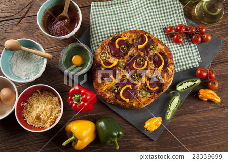 Tasty pizza, tomatoes and others ingredients Tasty pizza, tomatoes and others ingredients 28339699