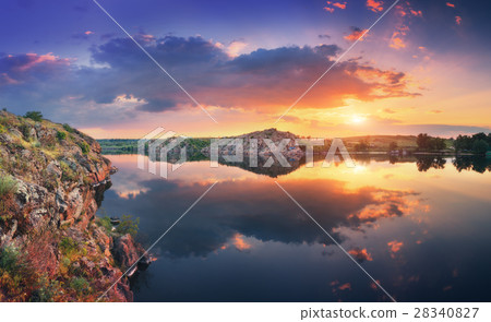 Lake against colorful sky with clouds at sunset 28340827