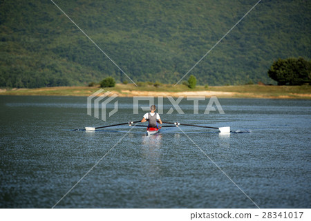 Child in the course of rowing on single Child in the course of rowing on single 28341017