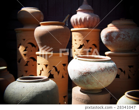 brown handmade earthenware ceramic water pot, jar 28341047