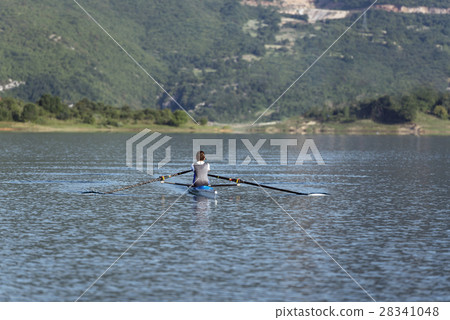 Child in the course of rowing on single Child in the course of rowing on single 28341048
