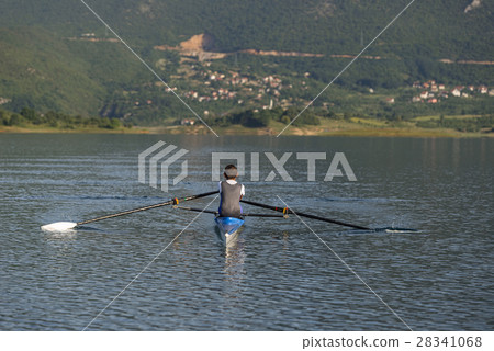 Child in the course of rowing on single 28341068