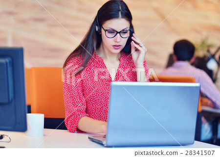 Young female in call center team Young female in call center team 28341507