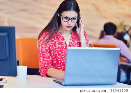 Young female in call center team 28341509