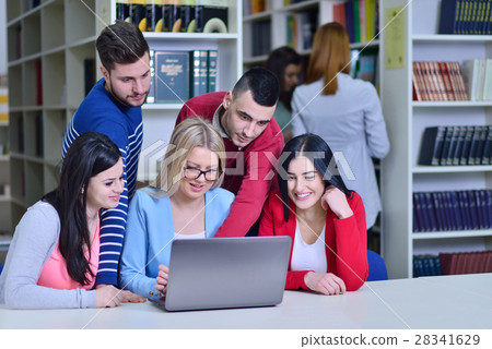 Group Of Students Working Together In Library With Group Of Students Working Together In Library With 28341629