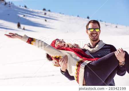 Happy Couple Having Fun on snow mountain. 28342199