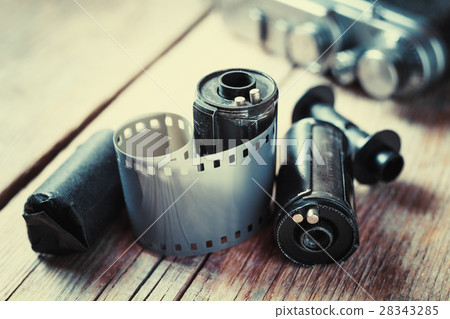 Old photo film rolls, cassette and retro camera 28343285