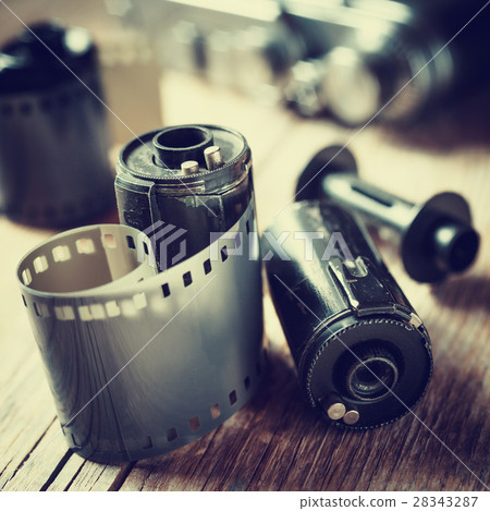 Old photo film rolls, cassette and retro camera. 28343287