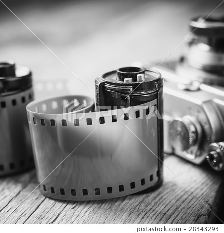 Old photo film cassette and retro camera Old photo film cassette and retro camera 28343293