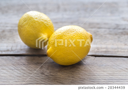 Fresh lemons on the wooden background 28344439