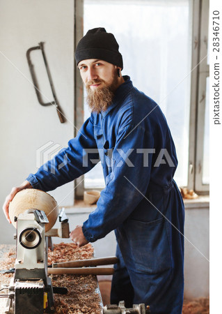 A man working with woodcarving instruments A man working with woodcarving instruments 28346710