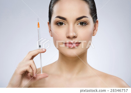 Cute girl with nude make up at studio and smiling Cute girl with nude make up at studio and smiling 28346757