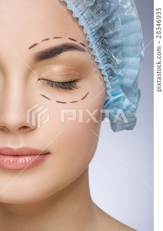 Girl with closed eyes in protective cap Girl with closed eyes in protective cap 28346935