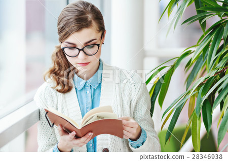 Lovely girl with glasses standing with notebook Lovely girl with glasses standing with notebook 28346938