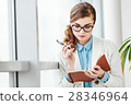 Lovely girl with glasses standing with notebook 28346964