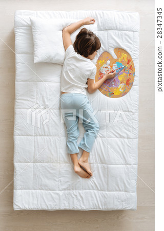 Creative child falling asleep with his palette Creative child falling asleep with his palette 28347345