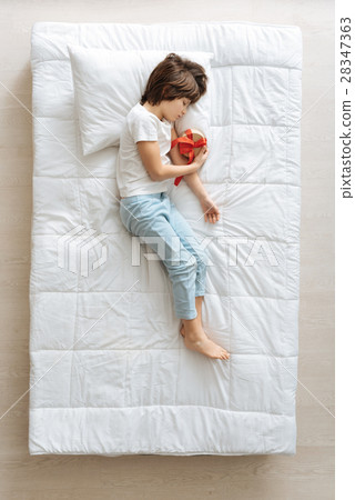 Dreamy kid hoping for a present Dreamy kid hoping for a present 28347363
