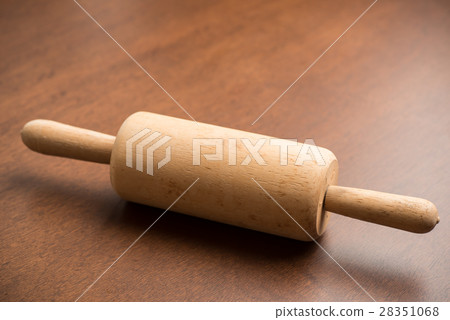 Rolling pin on wooden background 28351068