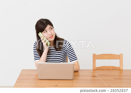 Woman phone watching personal computer 28352837
