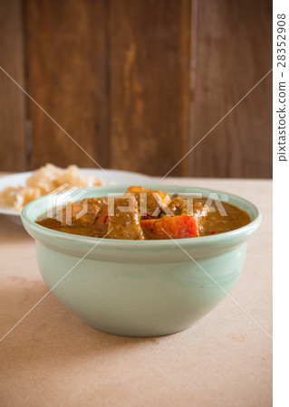 pork mussaman curry on wood background pork mussaman curry on wood background 28352908