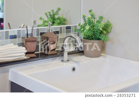 Faucet and lavatory with toothpastes, soap bottle Faucet and lavatory with toothpastes, soap bottle 28353271