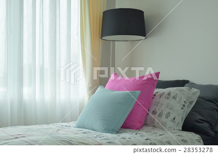 Light blue and pink pillow on single bed size Light blue and pink pillow on single bed size 28353278