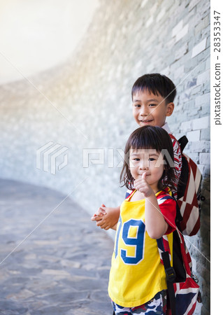Brother catching hand his sister and smiling 28353347
