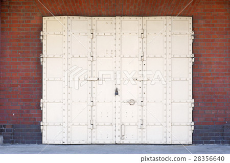 Iron door and brick wall 28356640