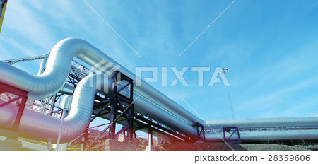 Steel pipelines and valves against blue sky 28359606