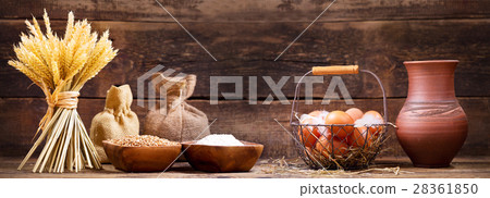 wheat ears with bowl of flour, milk and eggs wheat ears with bowl of flour, milk and eggs 28361850
