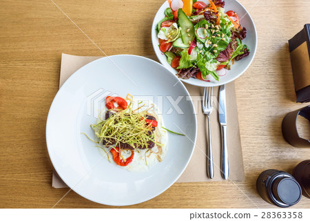 Beef medallions with greens 28363358