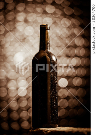 Bottle of wine in an aging cellar. Bottle of wine in an aging cellar. 28364700
