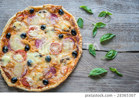 Pizza on the wooden board 28365307