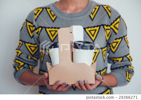 Woman holding a blank takeaway coffee cups white 28366271